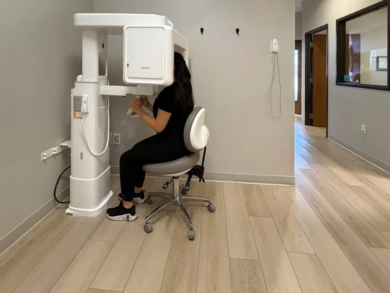 The cone-beam CT machine in the imaging room