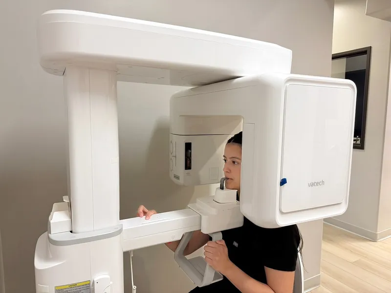A patient positioned in the cone-beam CT scanner